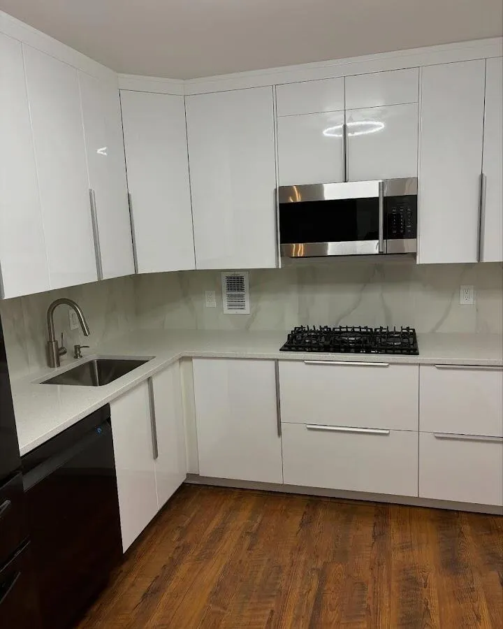 Restored kitchen with white cabinets after water damage in Columbia Heights